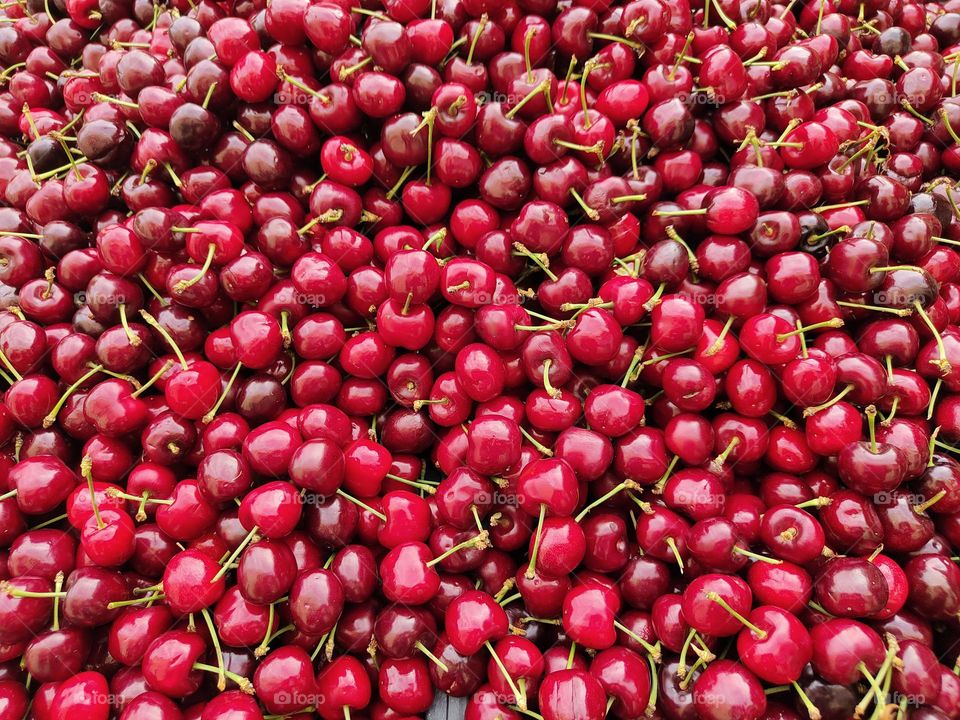 background with fresh and red summer cherries