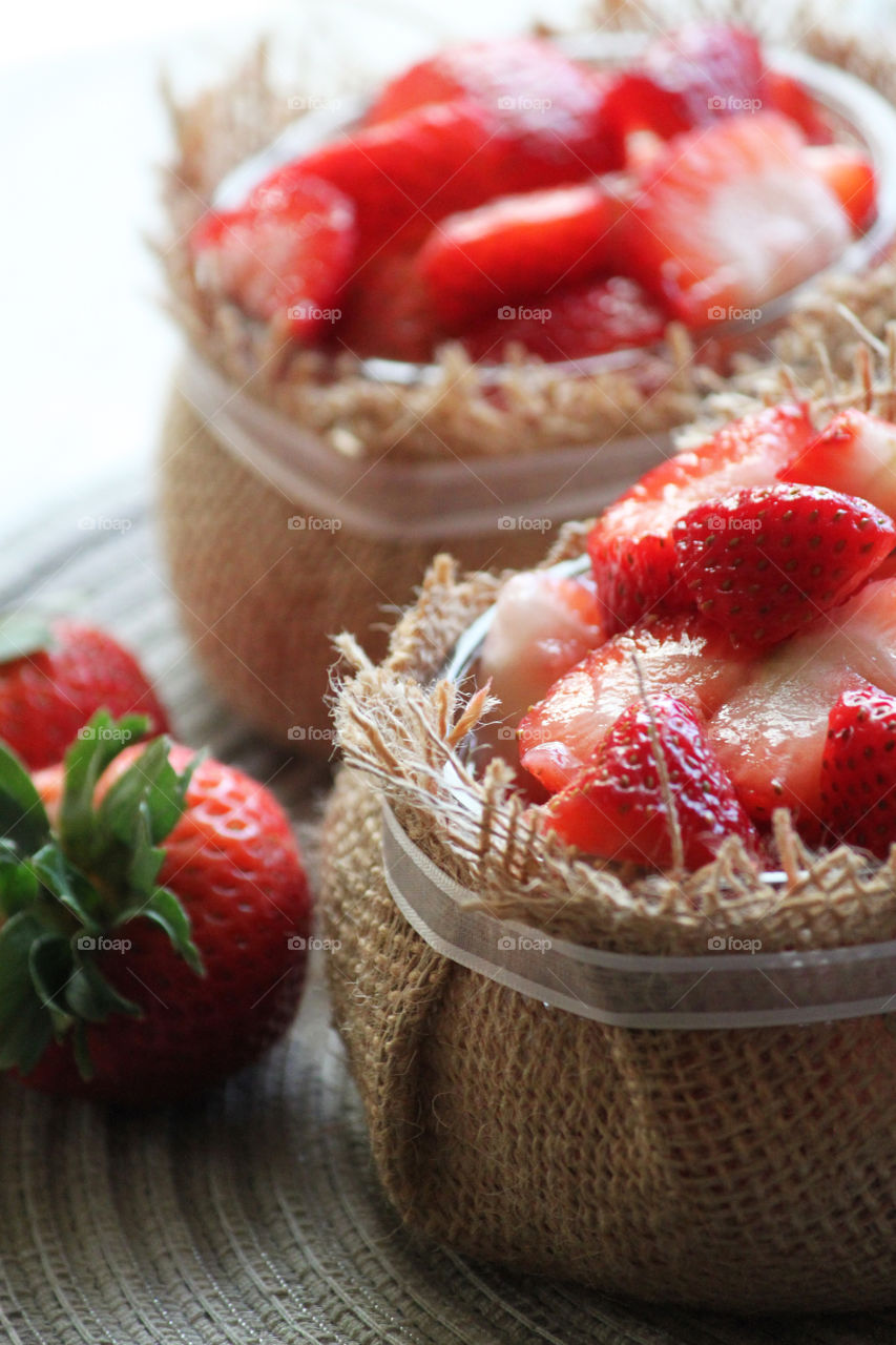 Bowls of fresh cut strawberries