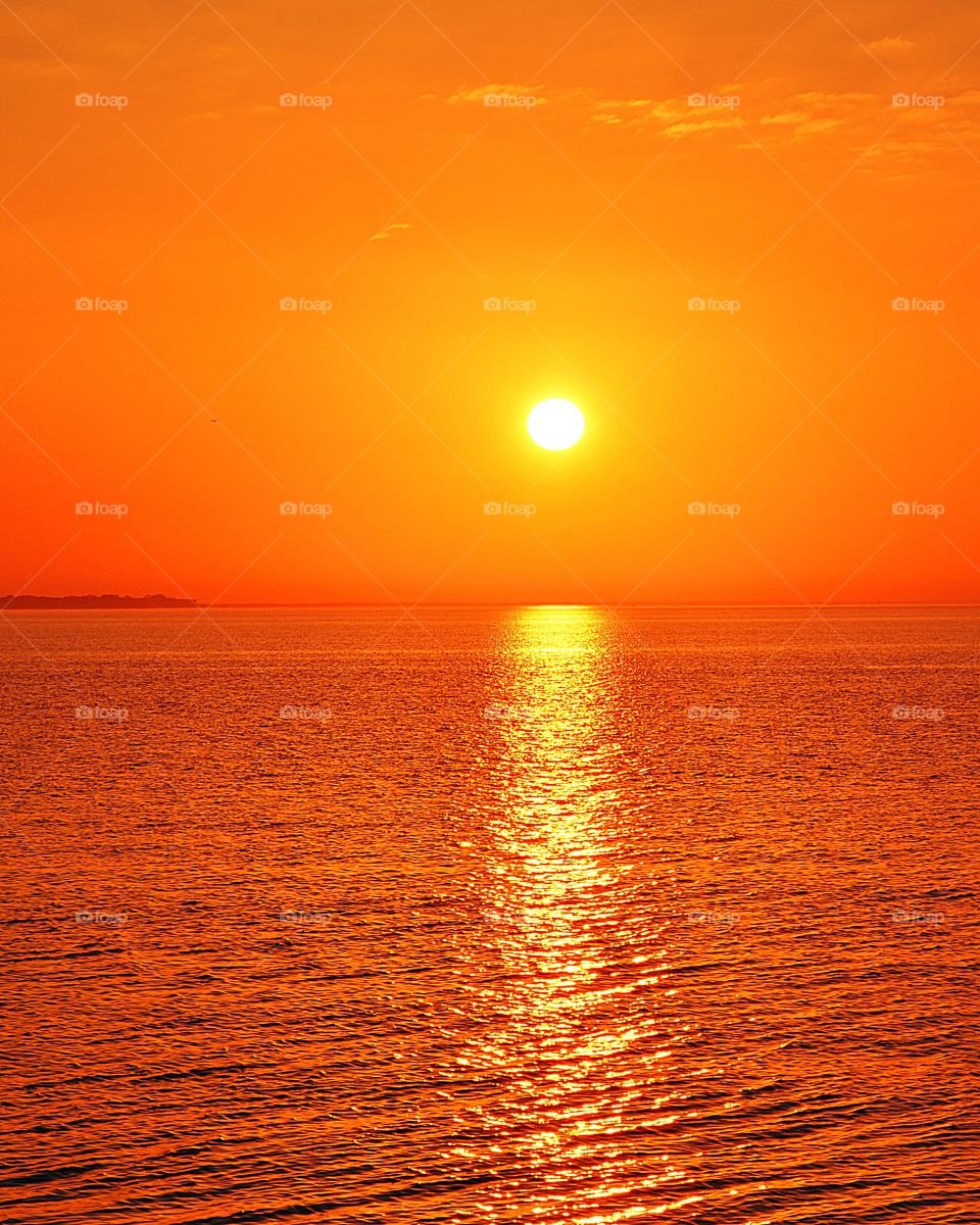 
The orange color stories. The vast, magnificent orange sunset. Sinking beneath the horizon, the threads of light lingered in the sky, mingling with the rolling clouds, dyeing the heavens bright orange.