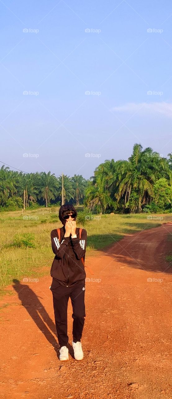 Walking under summer sun.