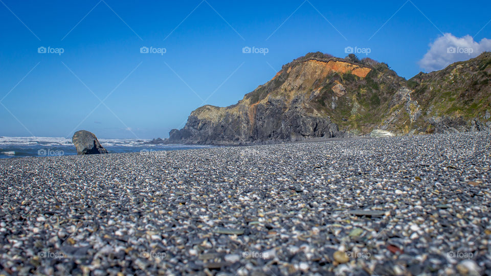 Pebbles. Small stones on a beach.
