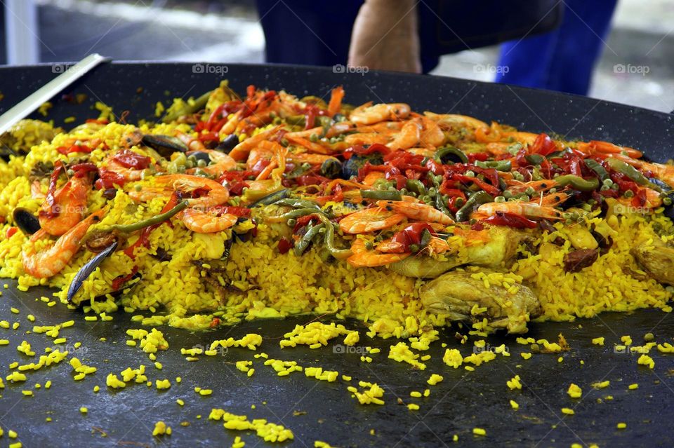 orange red green and yellow colors of Paella