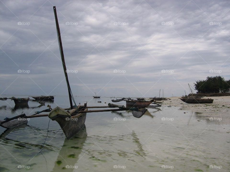 beach ocean boats water by anetteaventyr