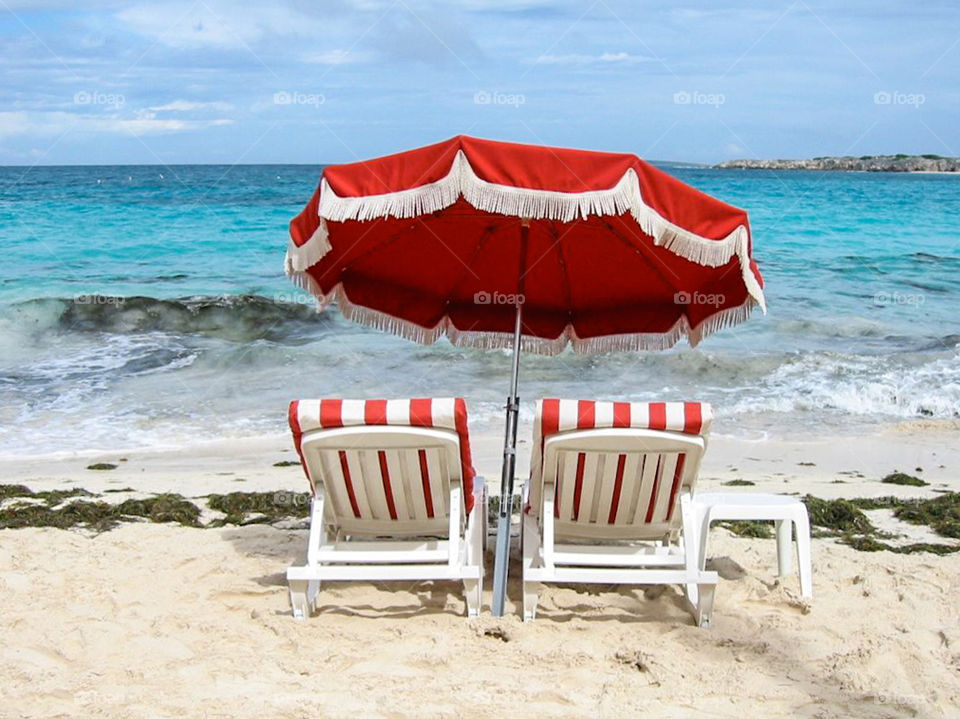 View of beach chairs and parasol