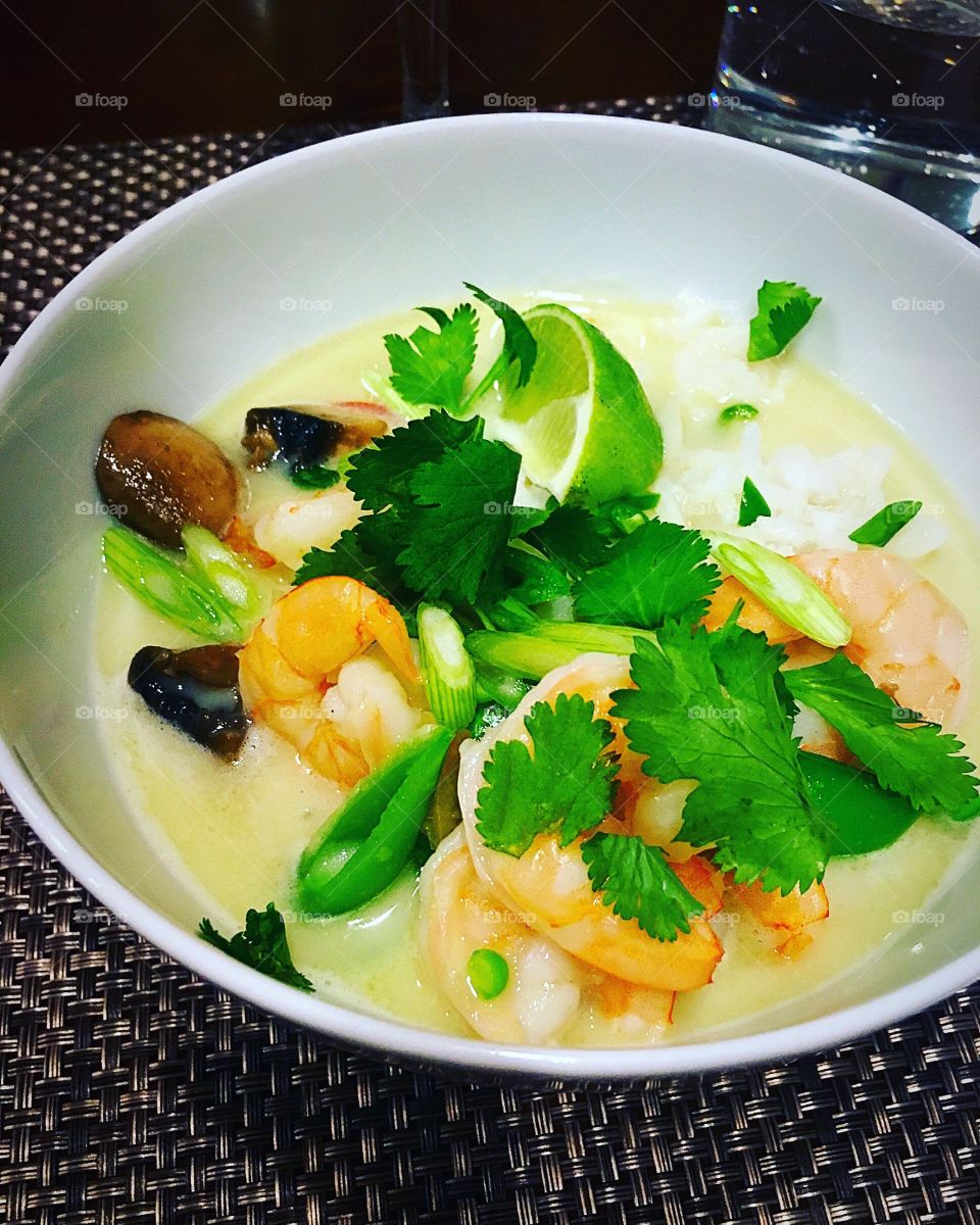 Coconut milk soup with mushrooms, shrimps and cilantro 