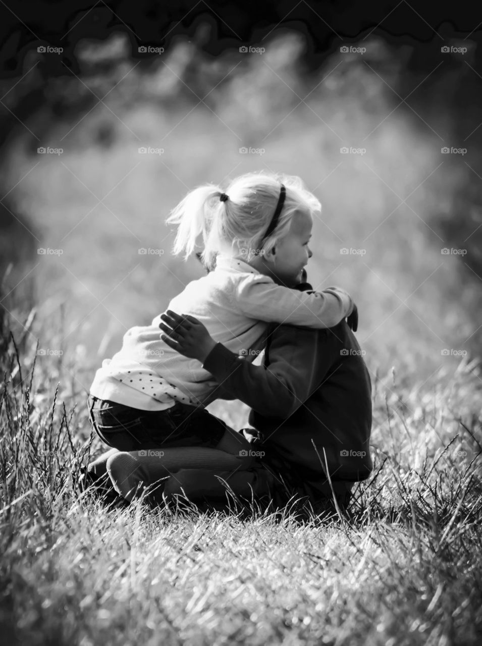 Kids hugging on Fields Brother and Sister