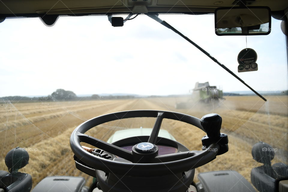 Drivers view harvesting barley