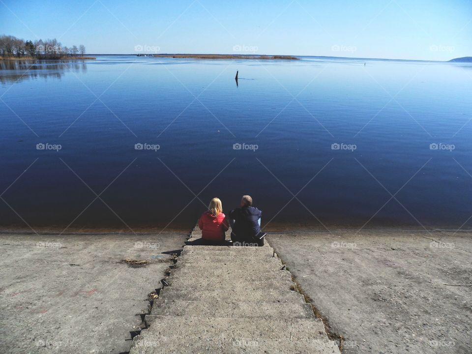 man and woman on the banks of the Dnieper River