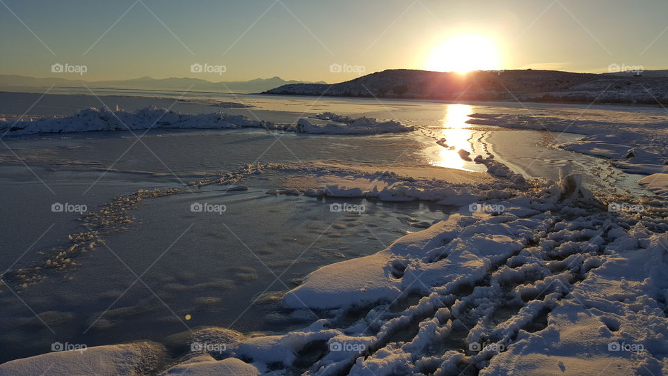 Utah lake at sunset in winter