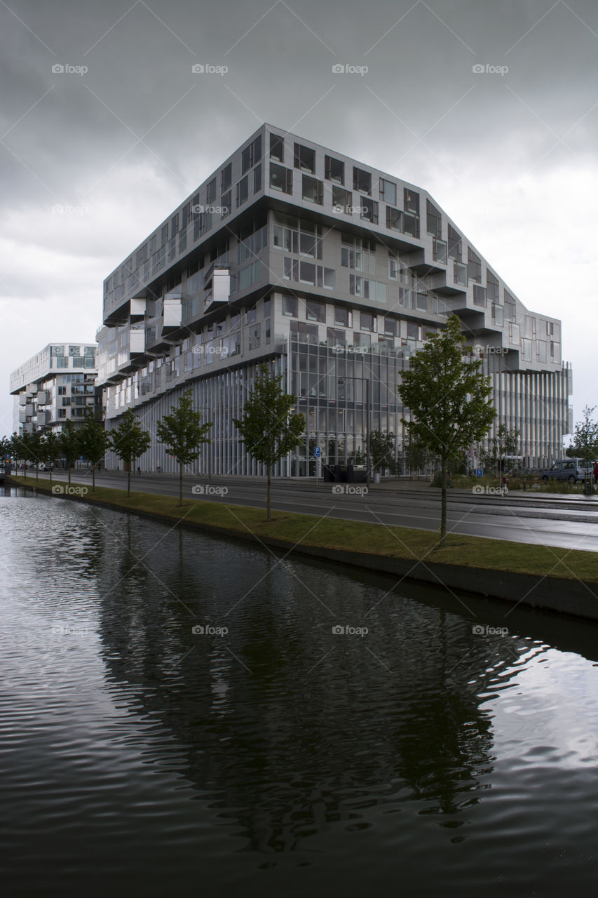 Contemporary building reflecting on water