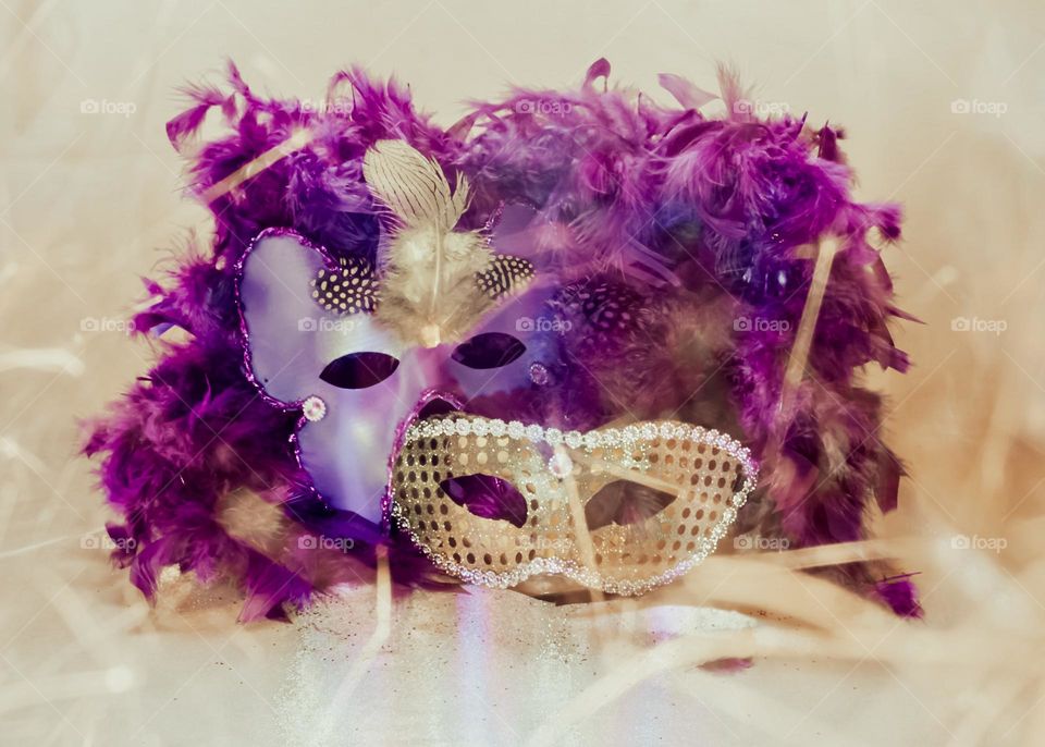 Carnival masks with feather boa & a sparkler
