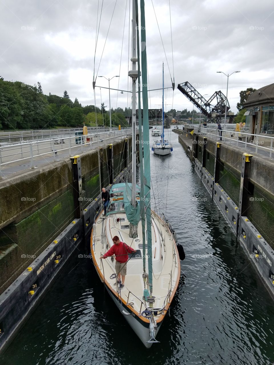 boats entering small chamber Hiram M Chittenden Locks. Seattle, Washington 5/18/2016