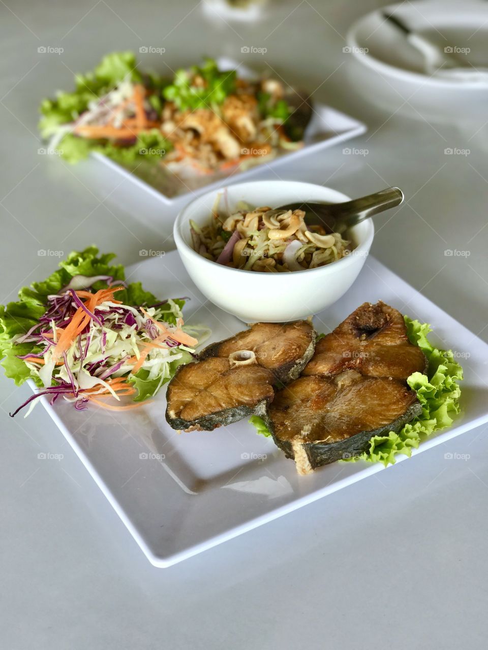 Deep fried fish with sour and spicy mango salad.