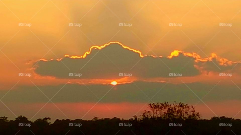 sun rays and an orange sky in beautiful Southeast Texas United States of America 2017 clouds sunset