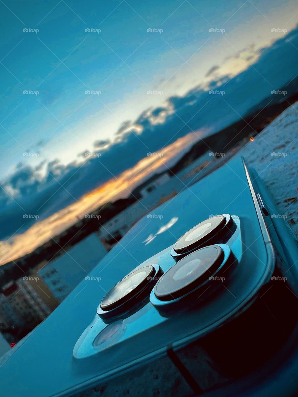 Attractive view of iPhone 13pro max with sunset