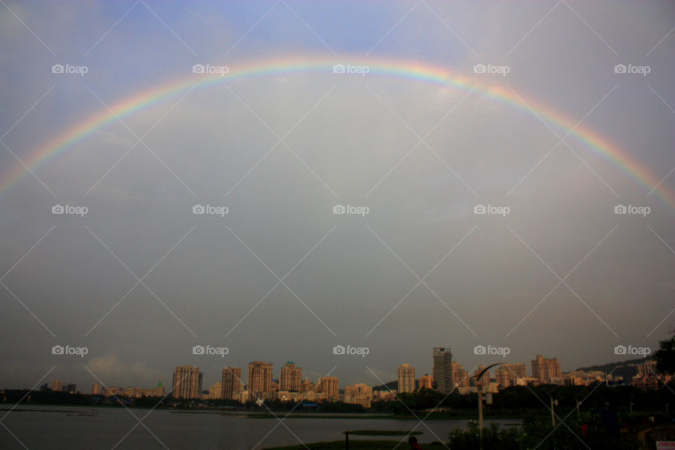 a rainbow over the city
