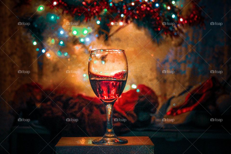 A glass of wine under the Christmas tree