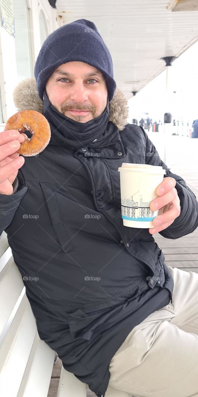 donut and coffee in Brighton pier on a cold windy day