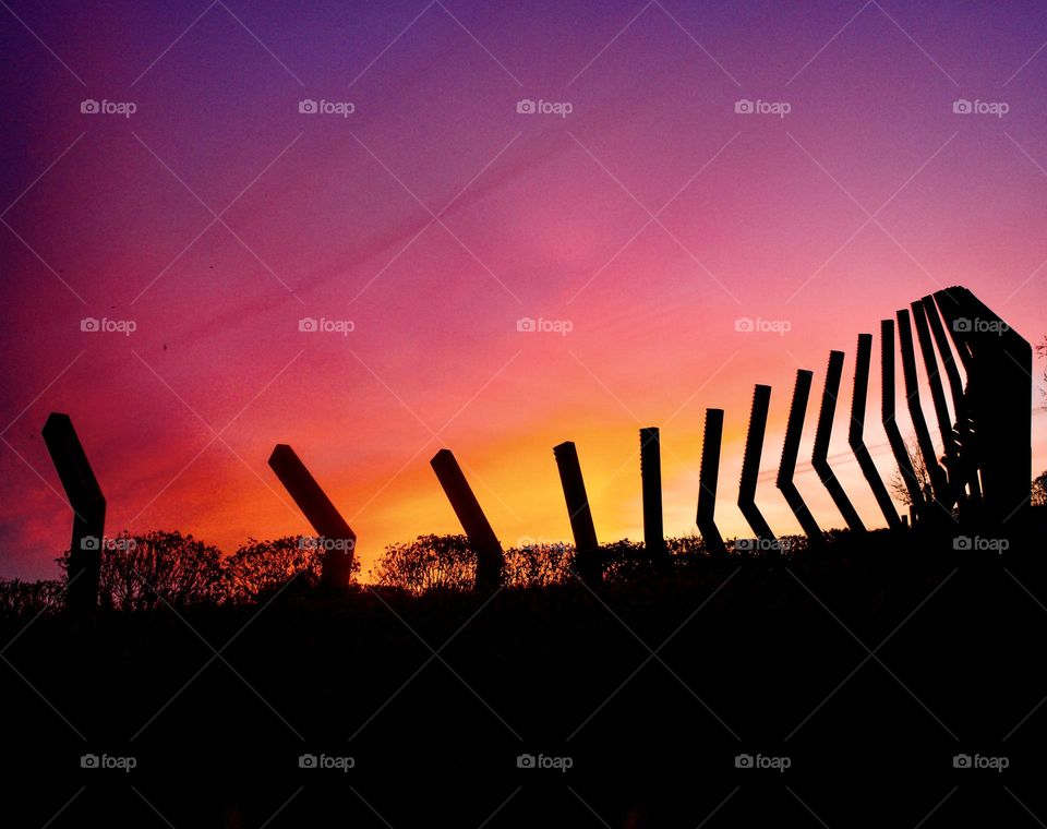 Sunrise behind the Moving Surfaces sculpture.