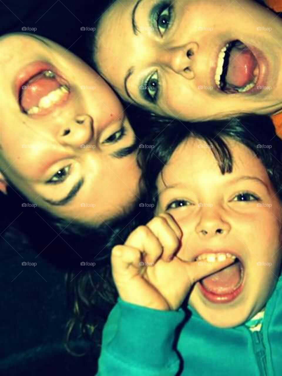 mom and two daughters being silly and having fun