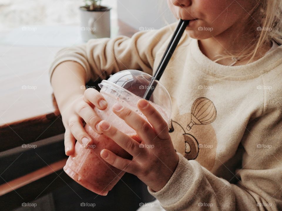 Little kid drinking smoothie