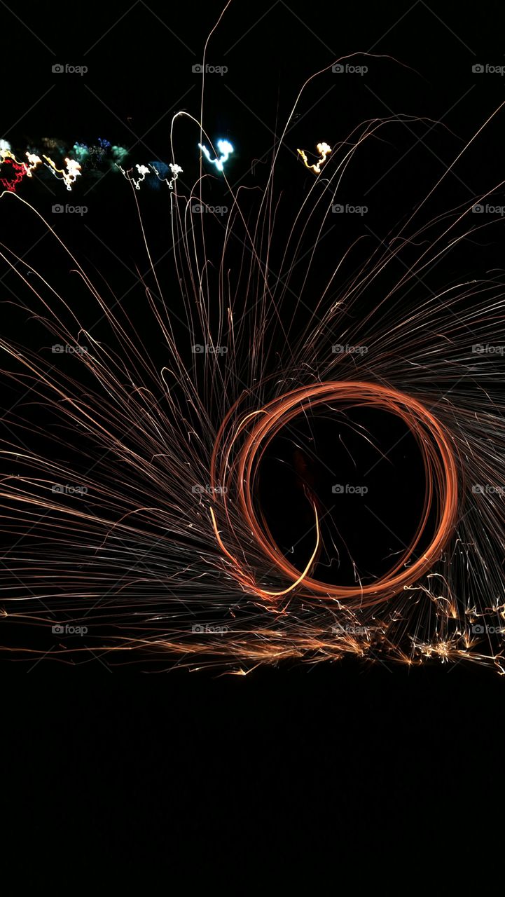 Light trail of flaming metal