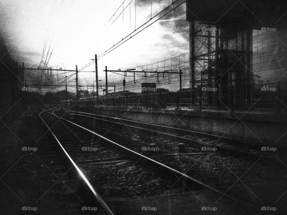 Railway in black and white. Heading home after work