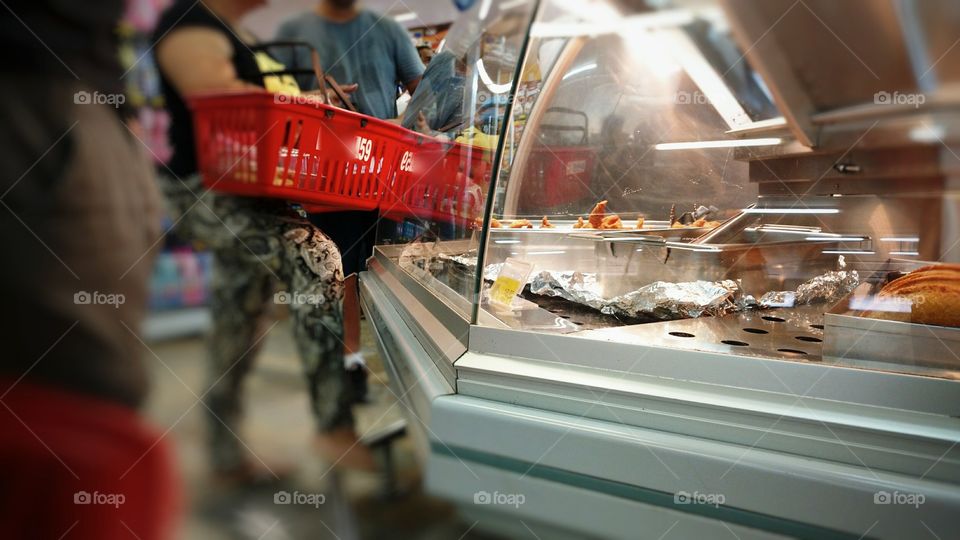 People buying food from retail store