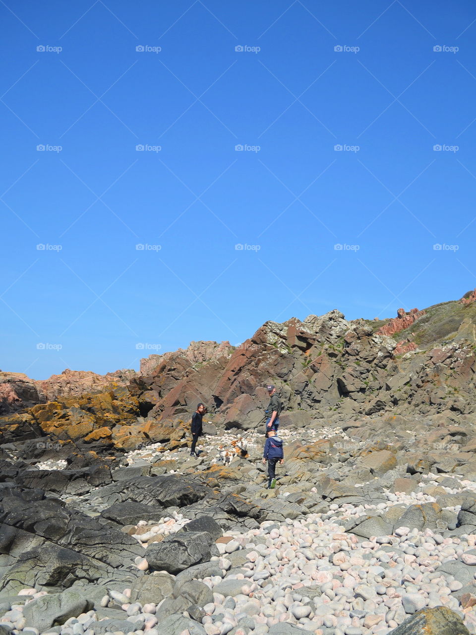 People walking in a rocky landscape