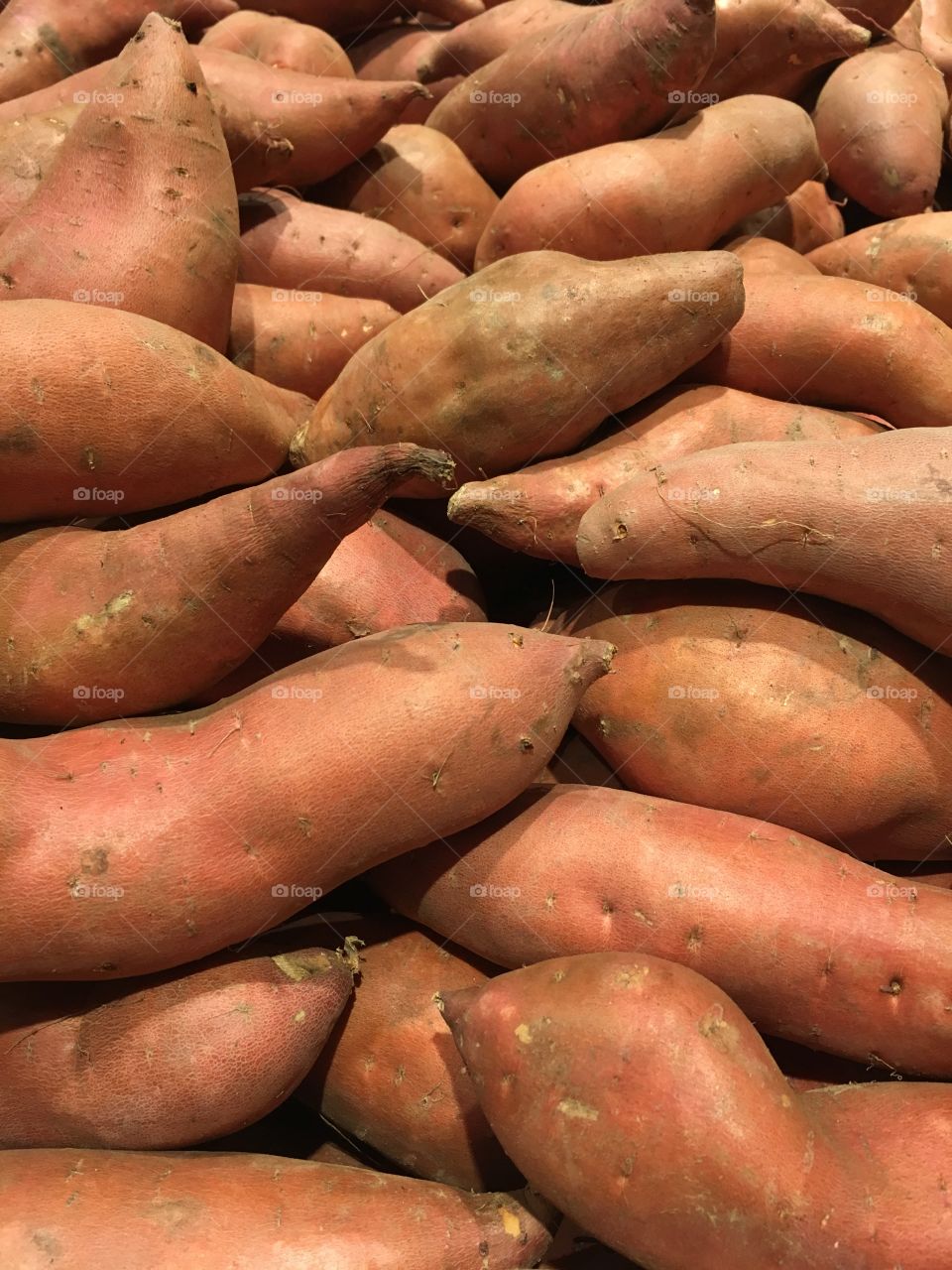 Sweet potatoes in a display bin