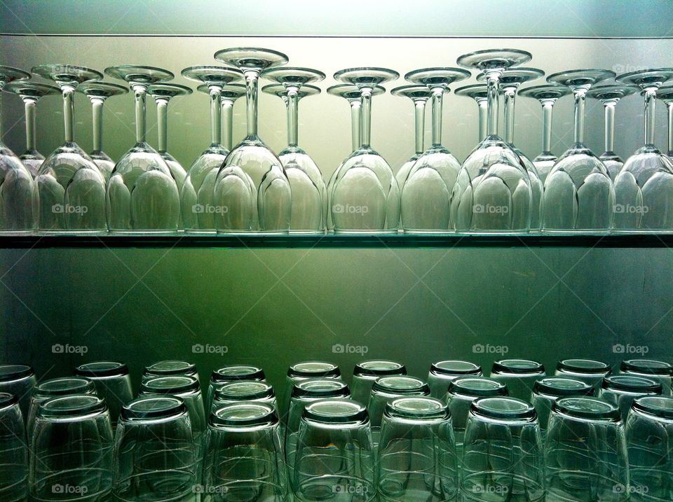 Glasses and cups on cupboard