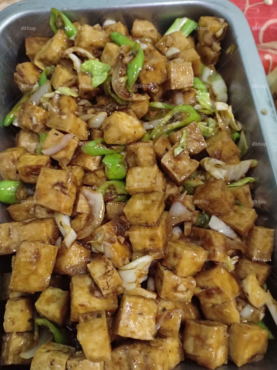 Savory spicy sautéed tofu in oysters sauce