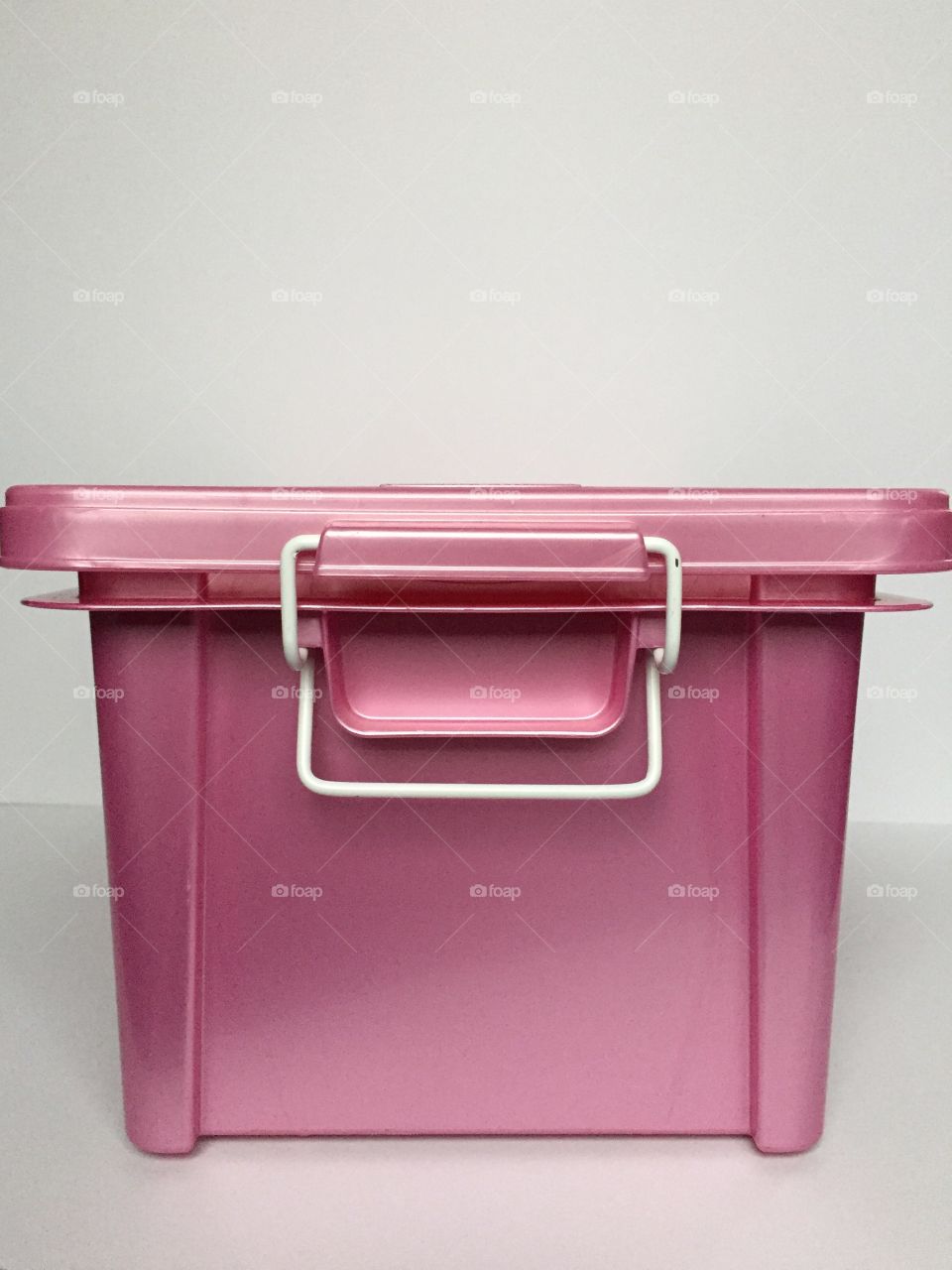Pink container on white background