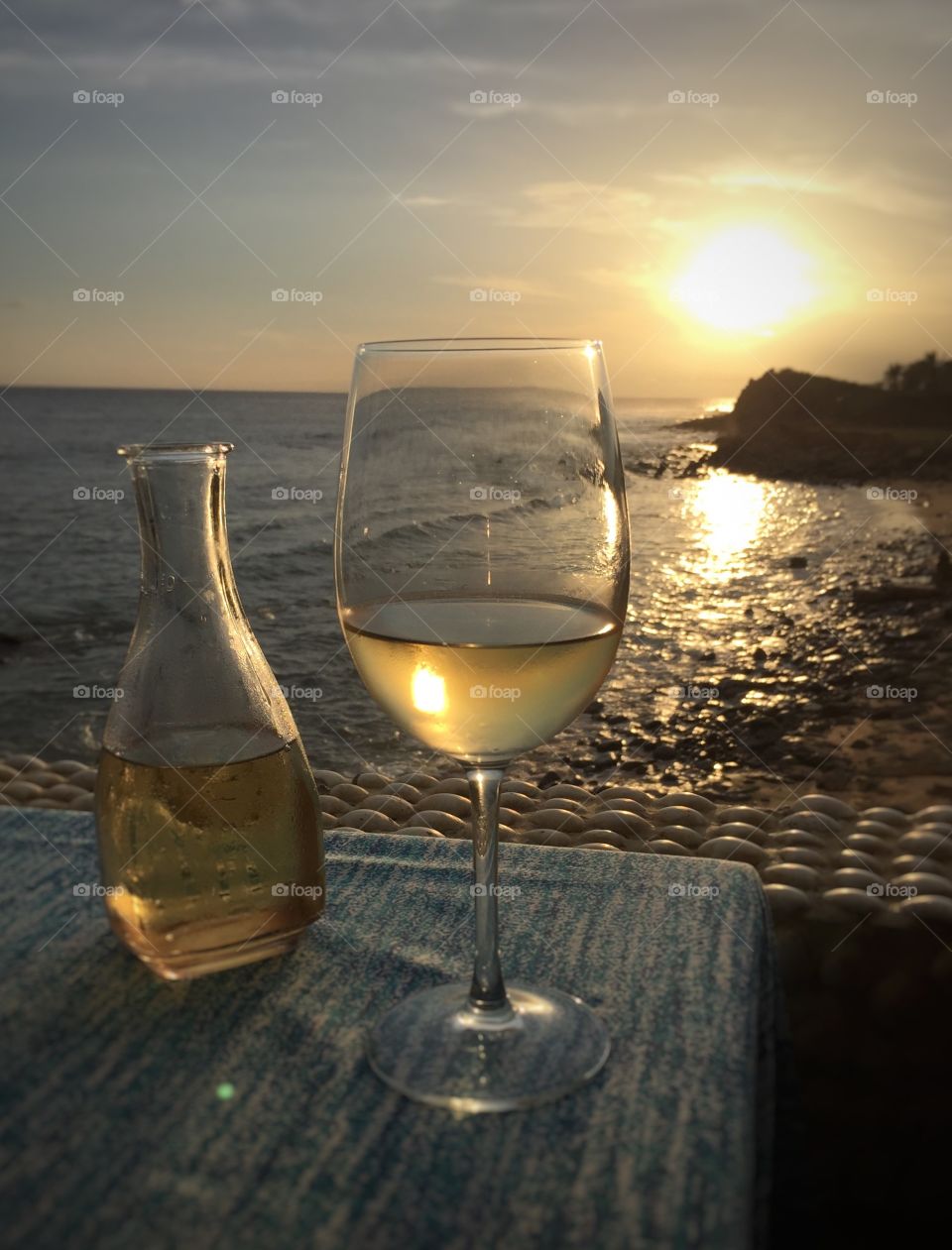 Glass of wine at sunset. Wine at the beach, Ngor, Senegal