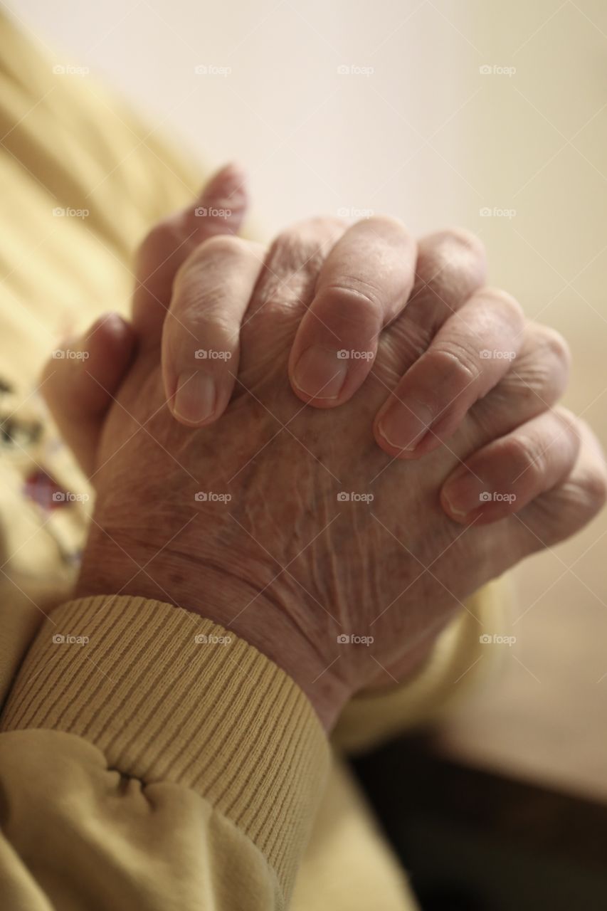 Aging hands pray