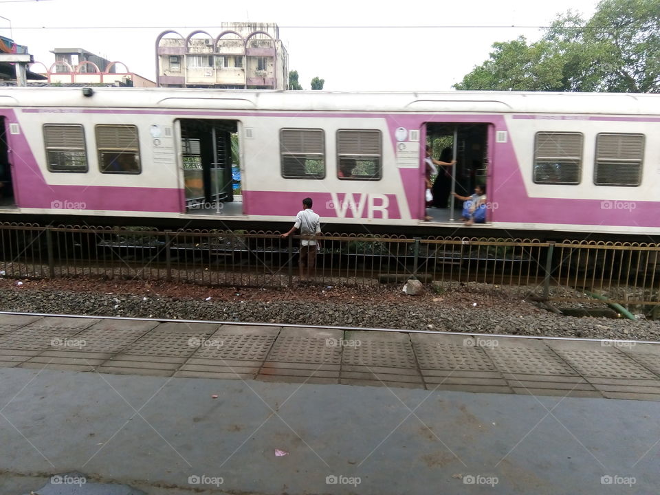 man crossing railway