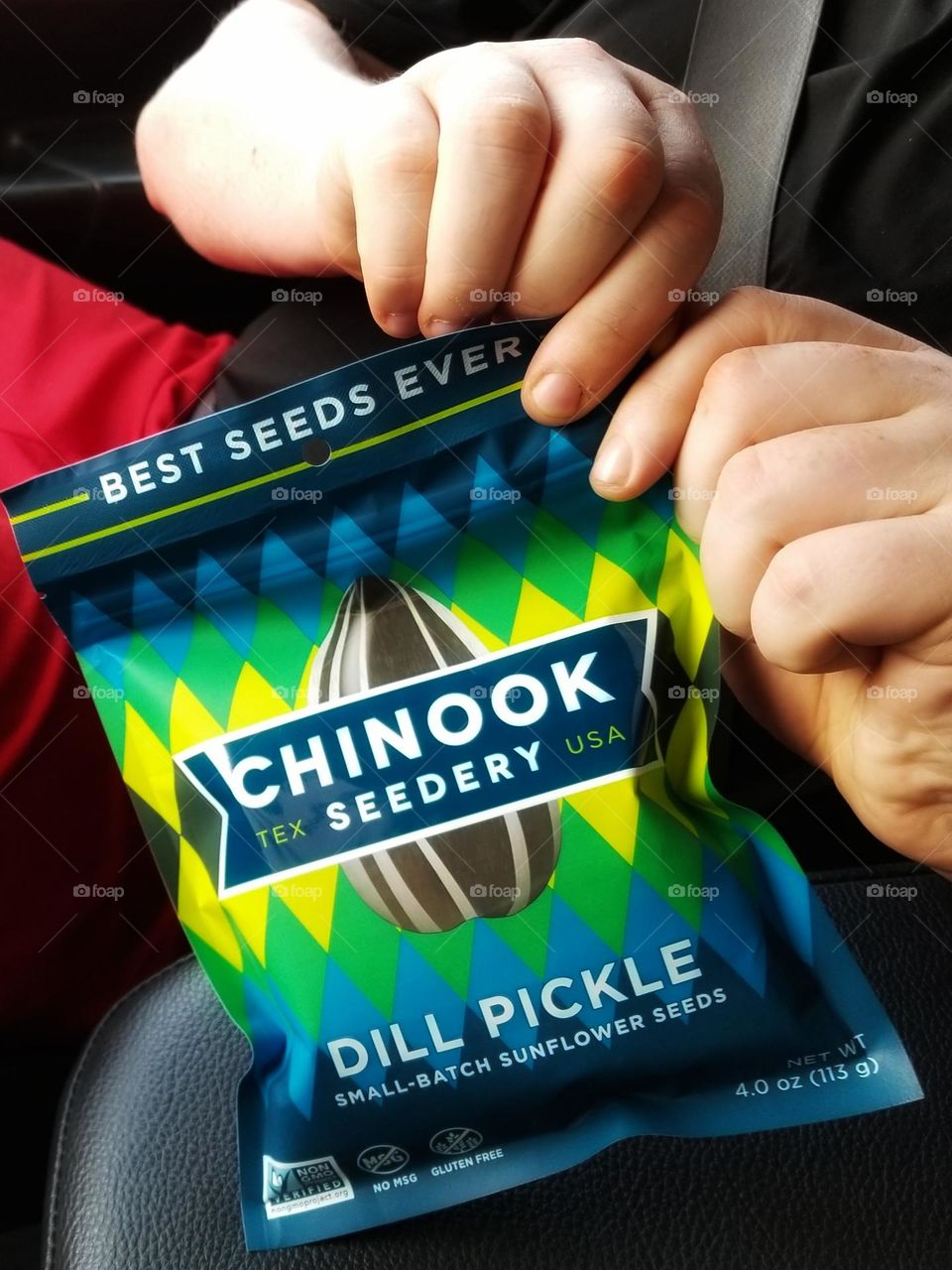 Man About to open some Chinook Sunflower Seeds