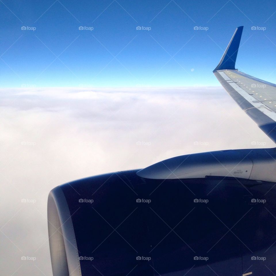 Airplane with cloud horizon