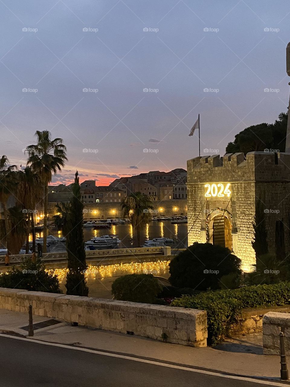 The twinkling lights of the old walled city of Dubrovnik, Croatia in quiet twilight of a winter night.