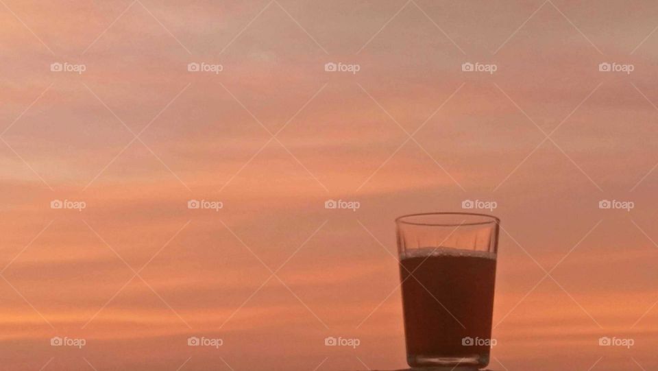 Beautiful cup of tea embraced the sunset.