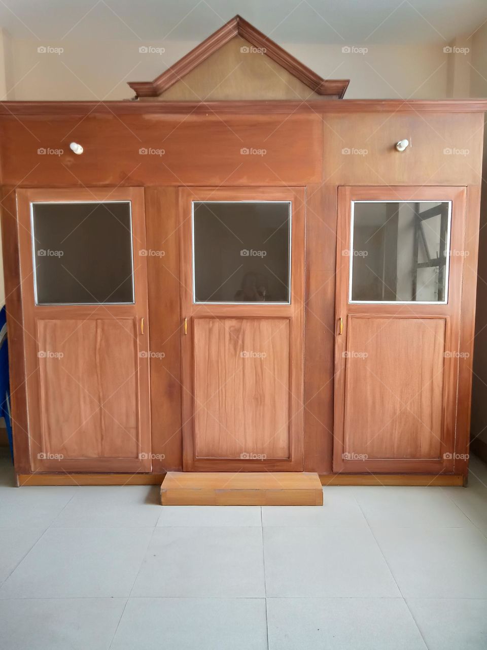CONFESSION ROOM , MADE OF WOOD AND SMALL GLASS WINDOW,, IN THE MIDDLE IS THE SEAT OF THE PRIEST, WHILE AT THE LEFT AND RIGHT SIDES ARE FOR THE CONFESSORS