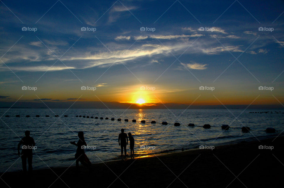 Silhouette and sunset above the sea