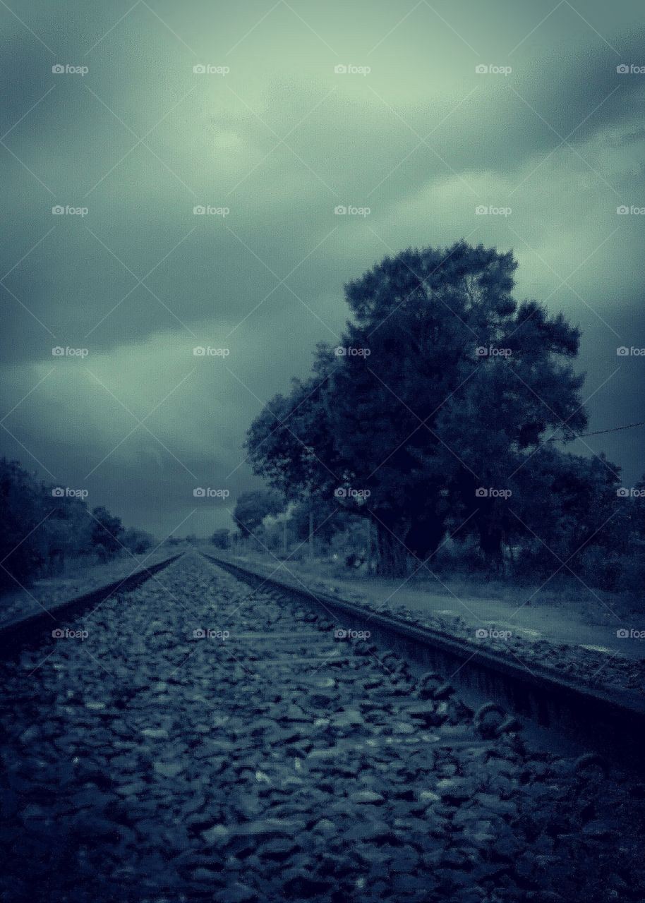 dark rain on railway