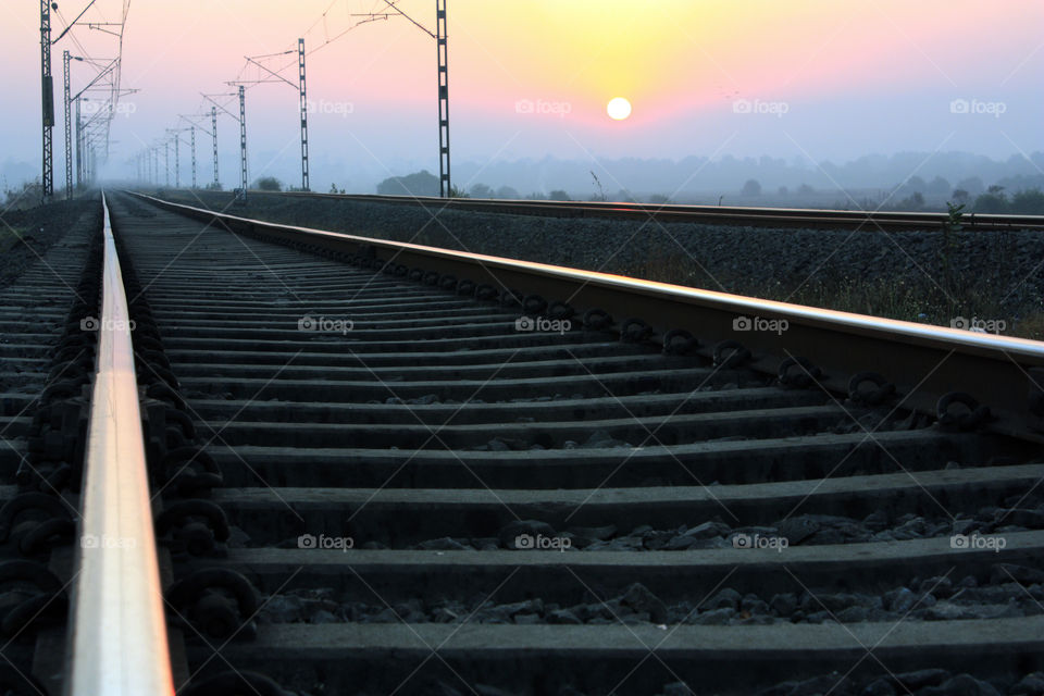 sunrise near rail track