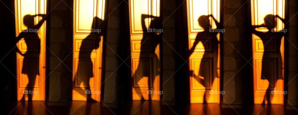 Shadow of a girl on the door