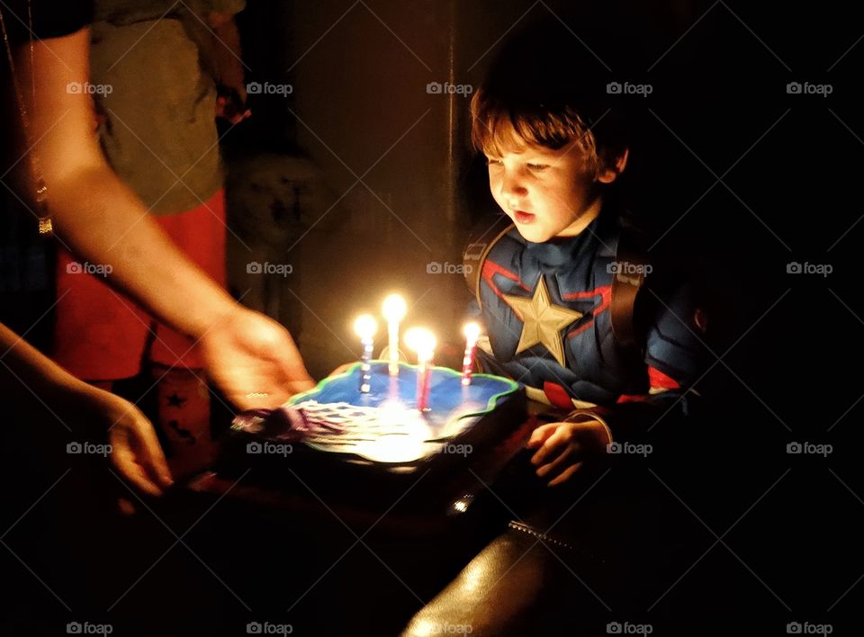 Young Boy Making A Birthday Wish
