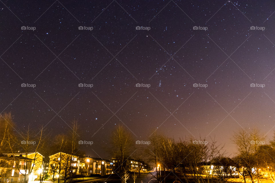 clear night sky chocked full of stars. center right you can see Orion