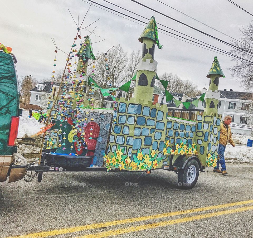 View Cardboard castle on trailer on road