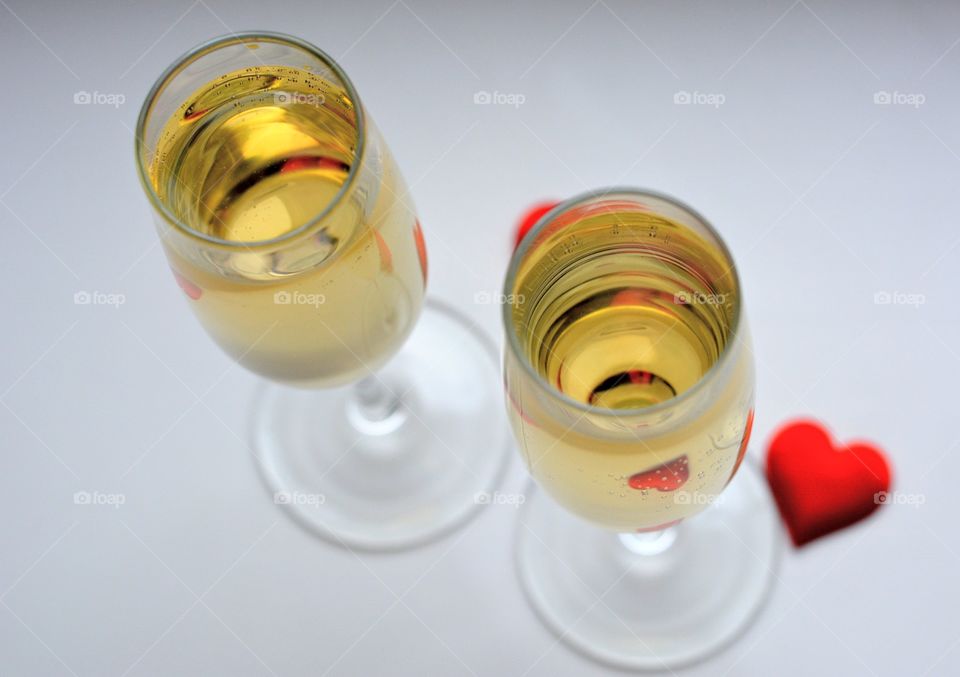 champagne glasses on a white background and heart