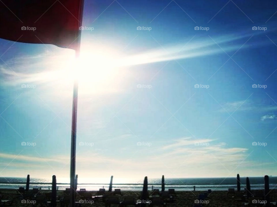 Sunshine behind a flag